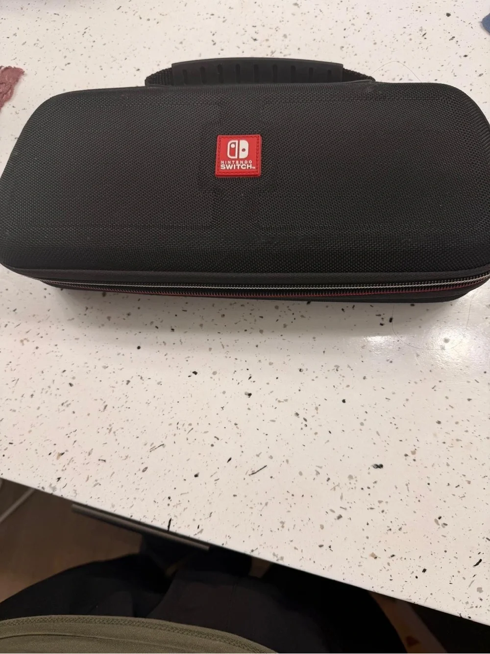 Nintendo Switch with Red and Blue Joy‑Con Controllers and Carry Case